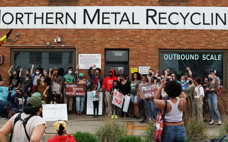 Community members protest Northern Metals using a restraining order and community power.